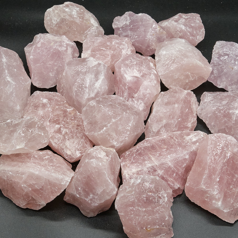 Pink raw crystals on a black background