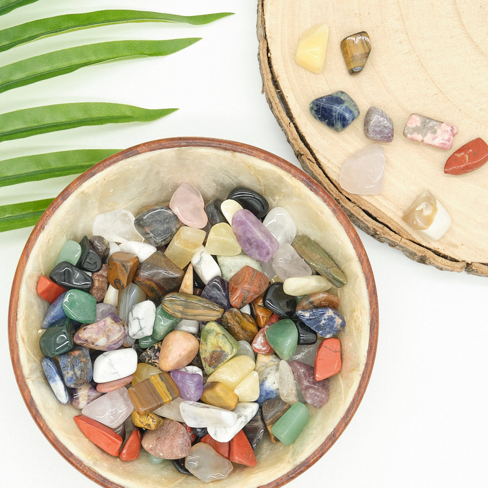 various mixed coloured gemstone in bowl