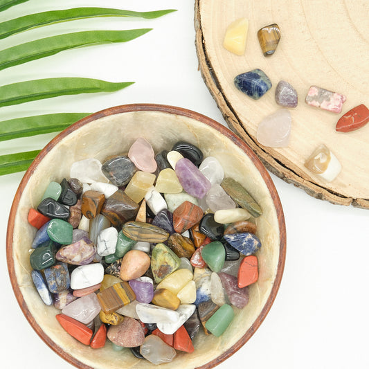 various mixed coloured gemstone in bowl