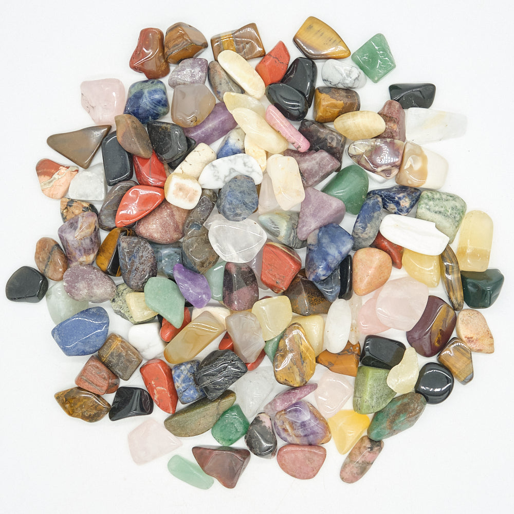 Assorted multicolored stones on a white background