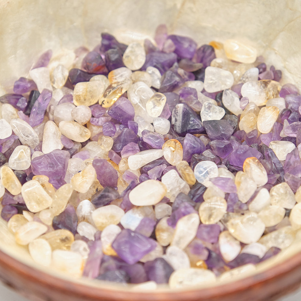 Close-up of small purple and yellow stones in a bowl