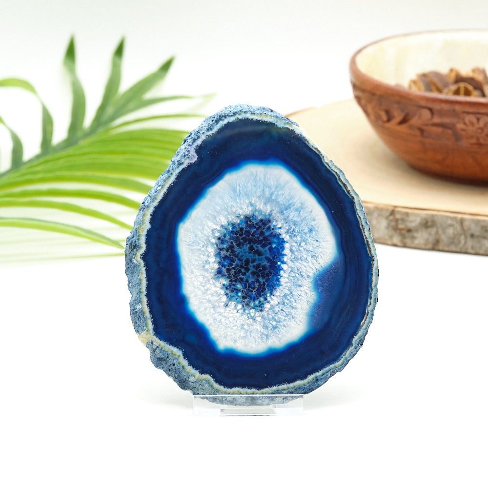 Blue agate stone with a natural pattern on a white background