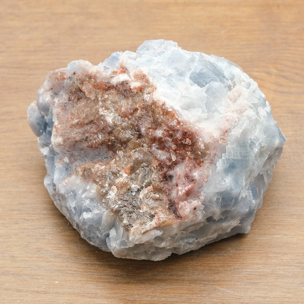 Mineral calcite sample on a wooden surface
