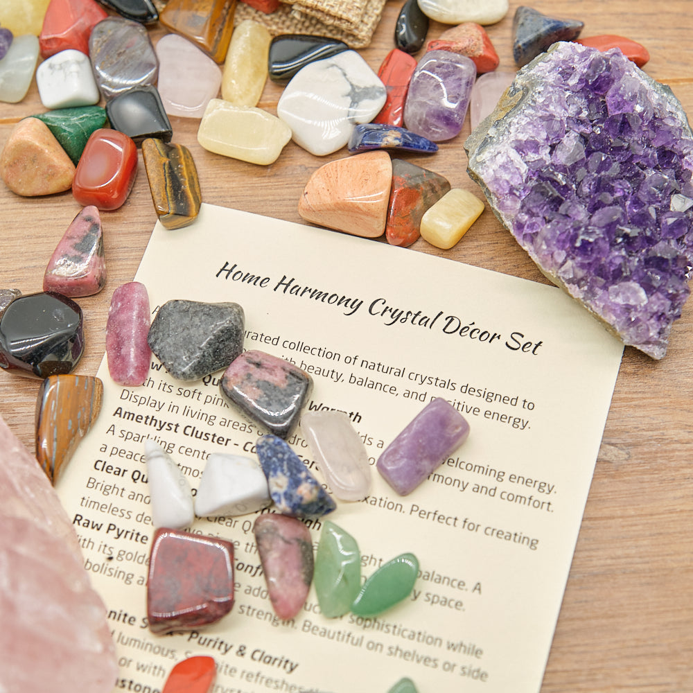 Collection of colorful crystals on a wooden surface with a descriptive card.