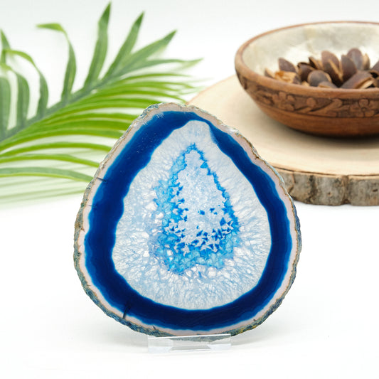 large blue agte slice crystal on white background
