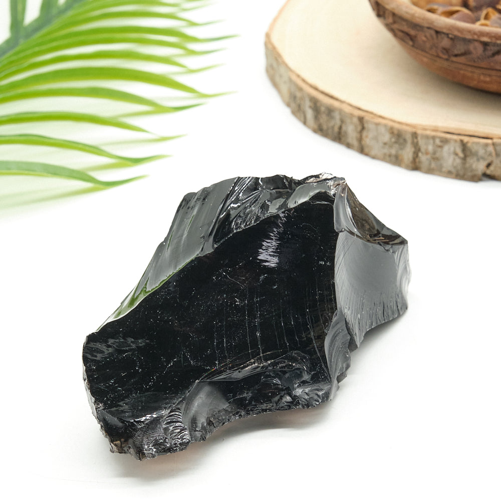 large black obsidian rock on white background