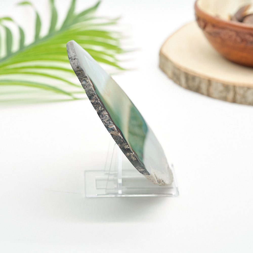 Decorative stone on a stand with a blurred natural background