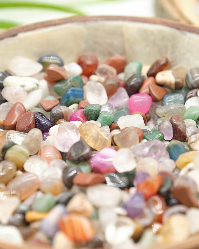 Colorful pebbles in a bowl with a blurred background