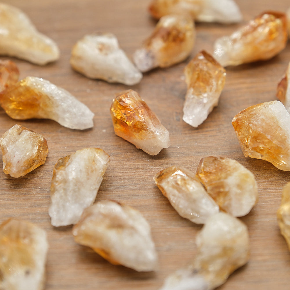 Close-up of citrine points  crystals on a wooden surface