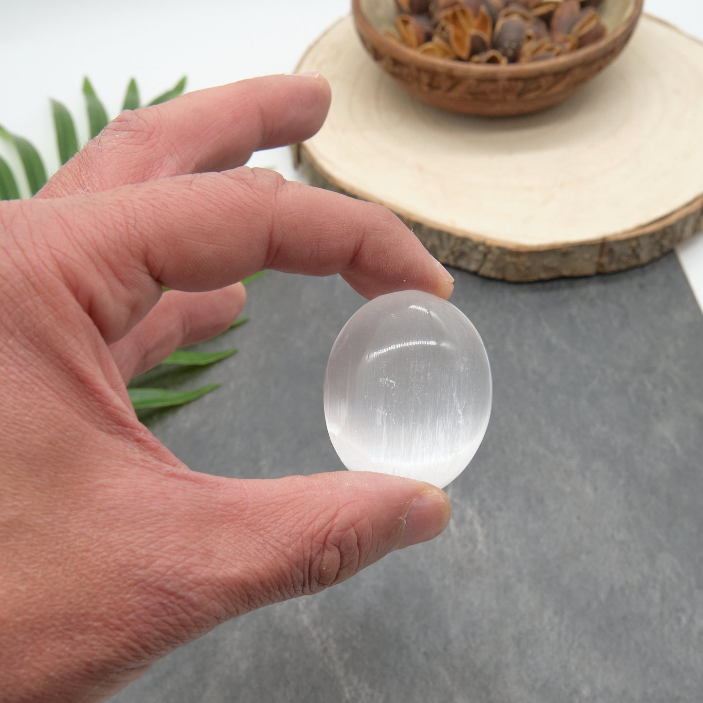 white selenite palmstone small size