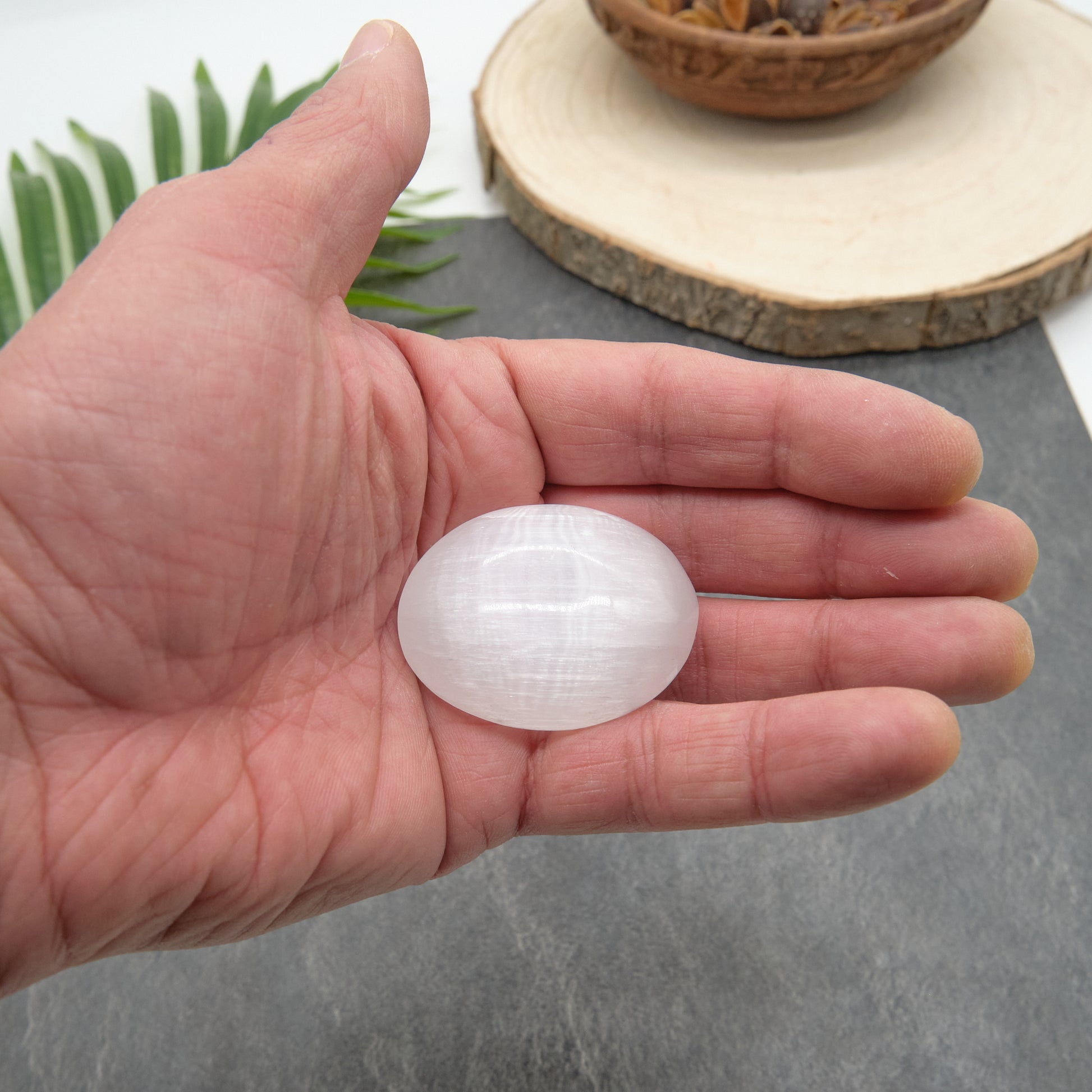 white selenite palmstone small size