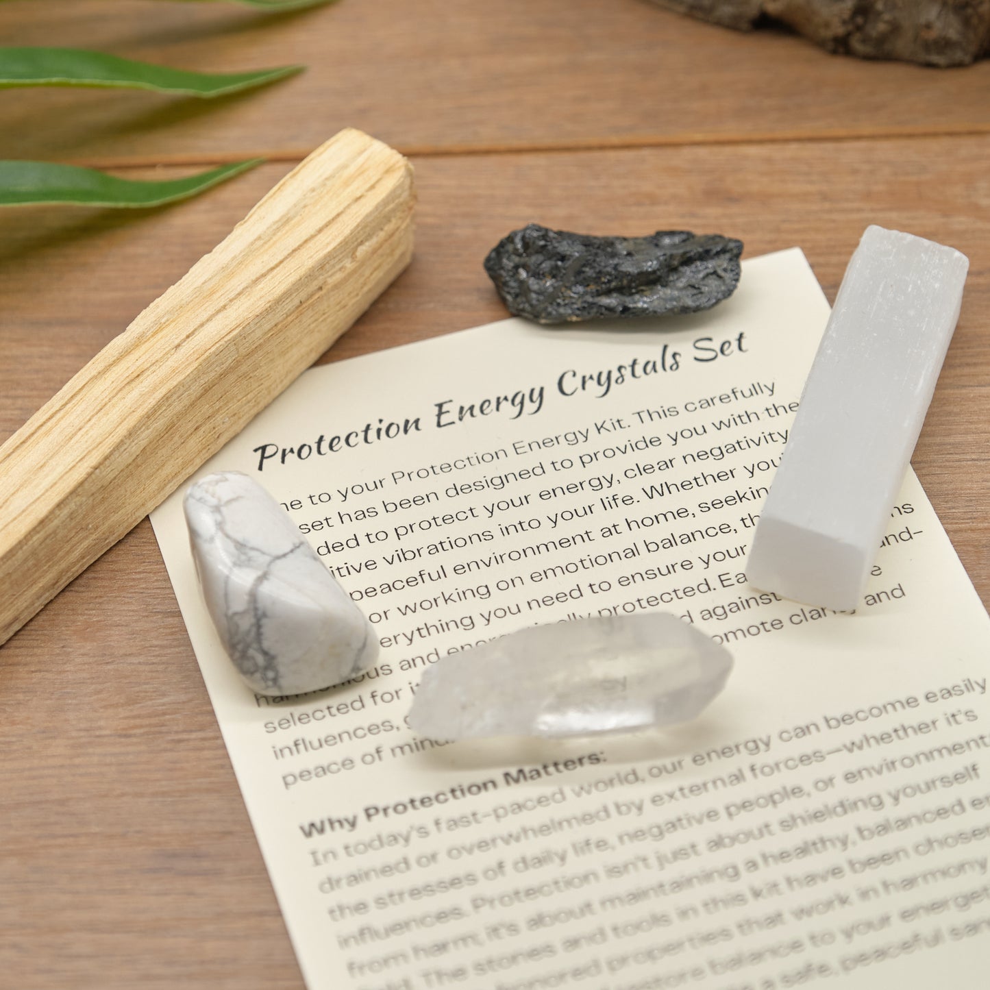 protection crystals set with quartz point, black tourmaline, white howlite, palo santo stick, selenite and meaning card