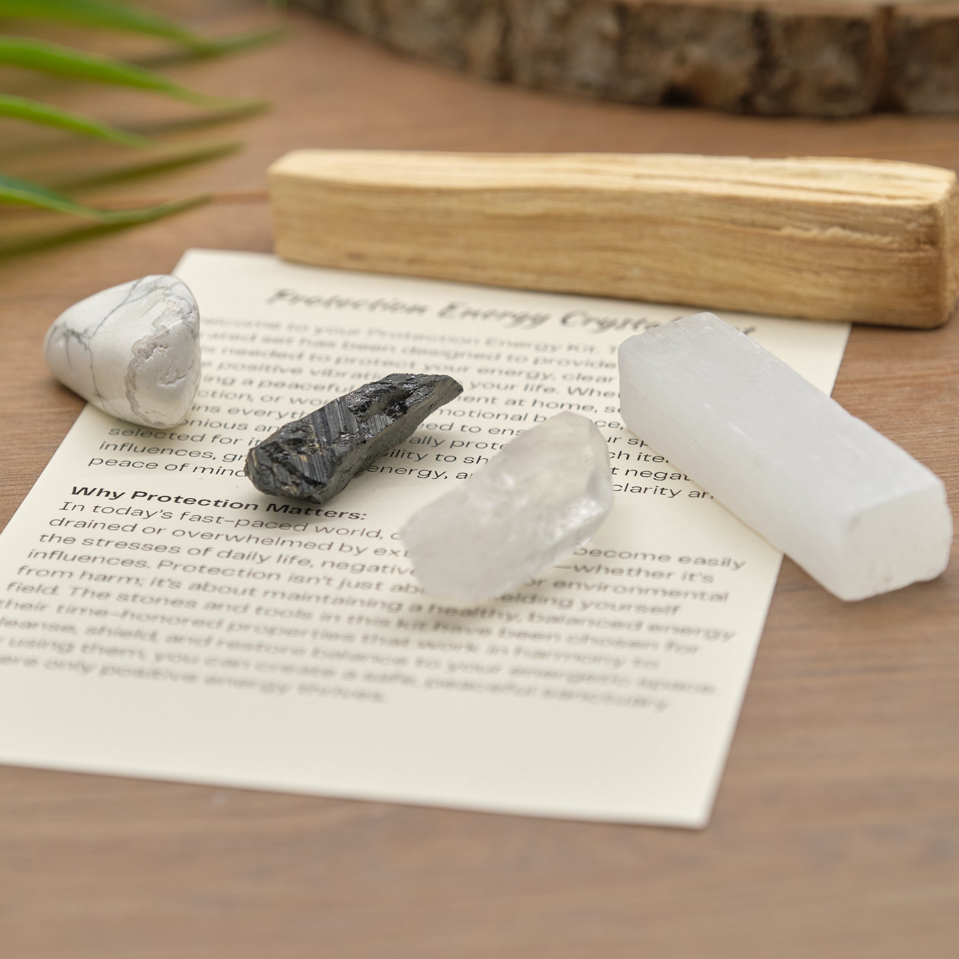 protection crystals set with quartz point, black tourmaline, white howlite, palo santo stick, selenite and meaning card