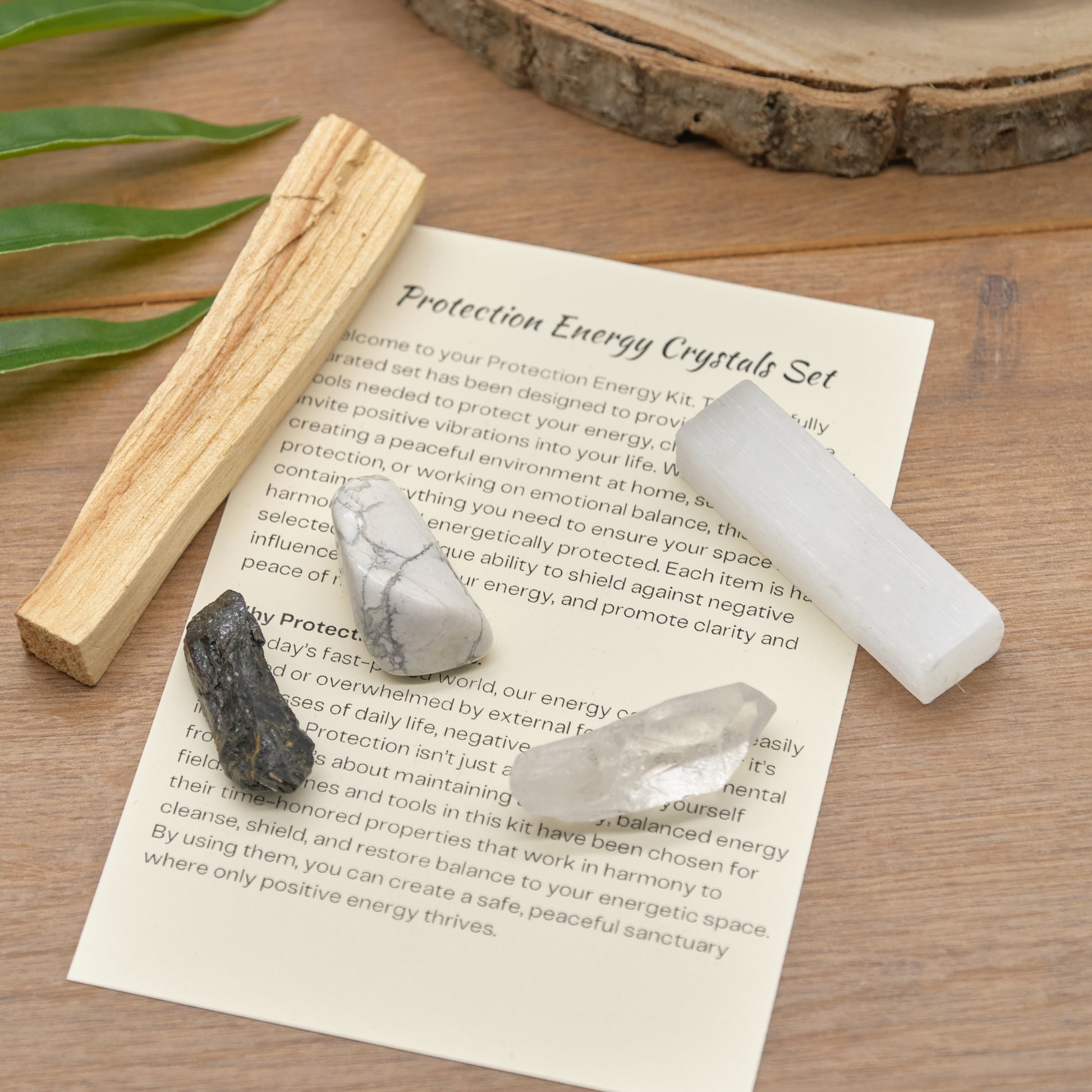 protection crystals set with quartz point, black tourmaline, white howlite, palo santo stick, selenite and meaning card