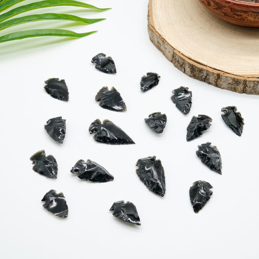 small black obsidian arrowhead carved rough crystal