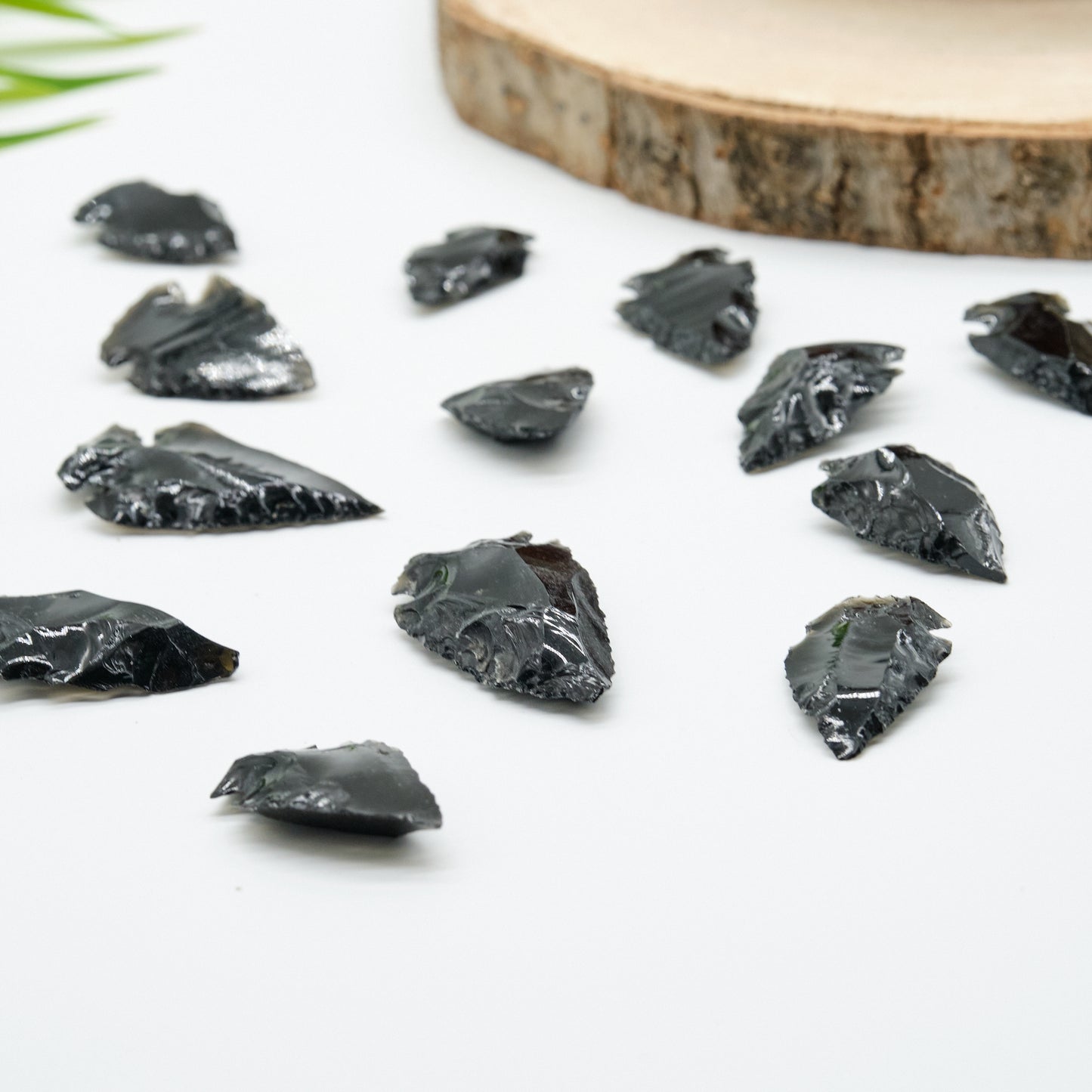 small black obsidian arrowhead carved rough crystal