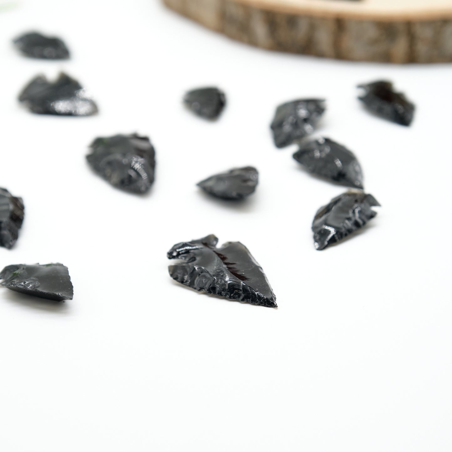 small black obsidian arrowhead carved rough crystal