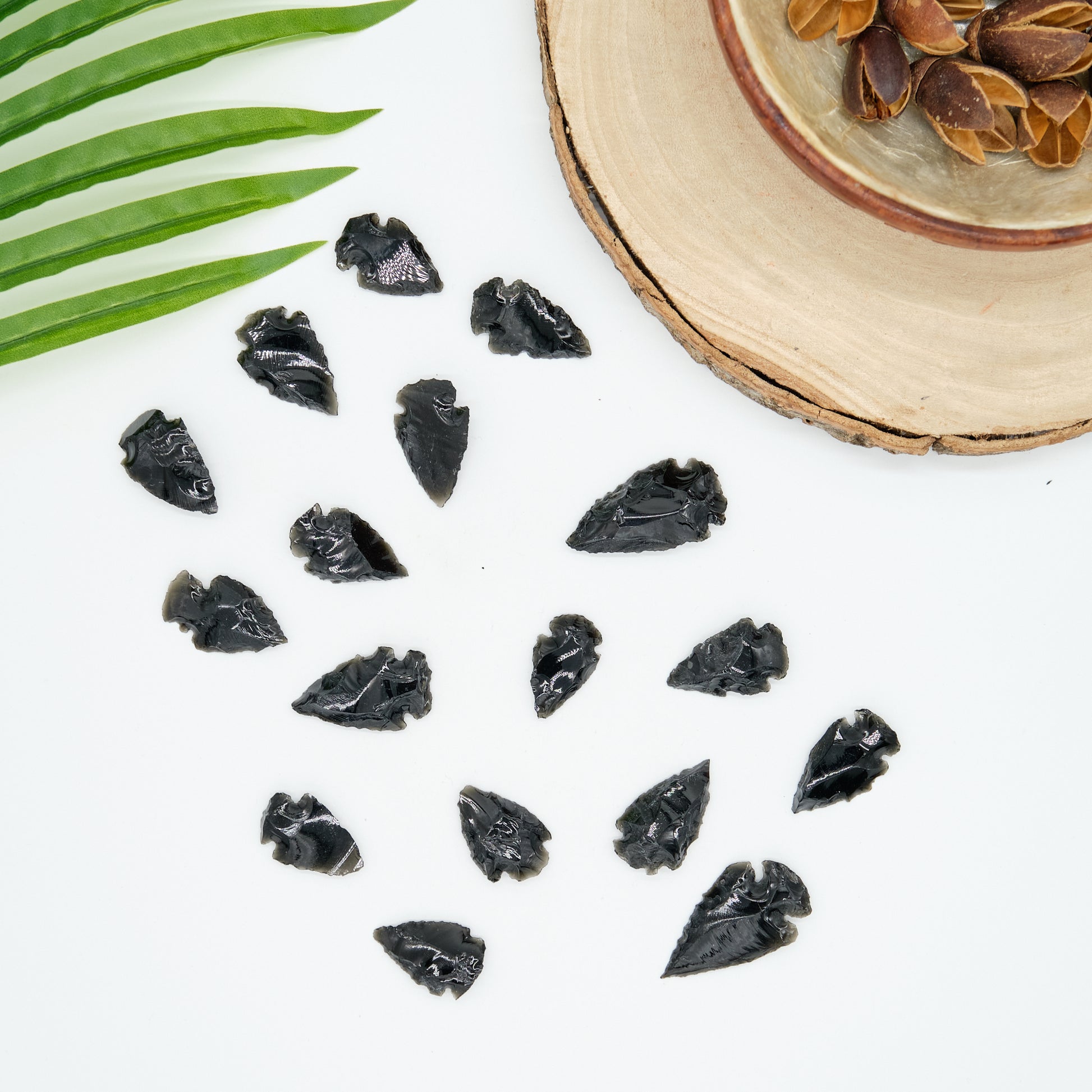 small black obsidian arrowhead carved rough crystal