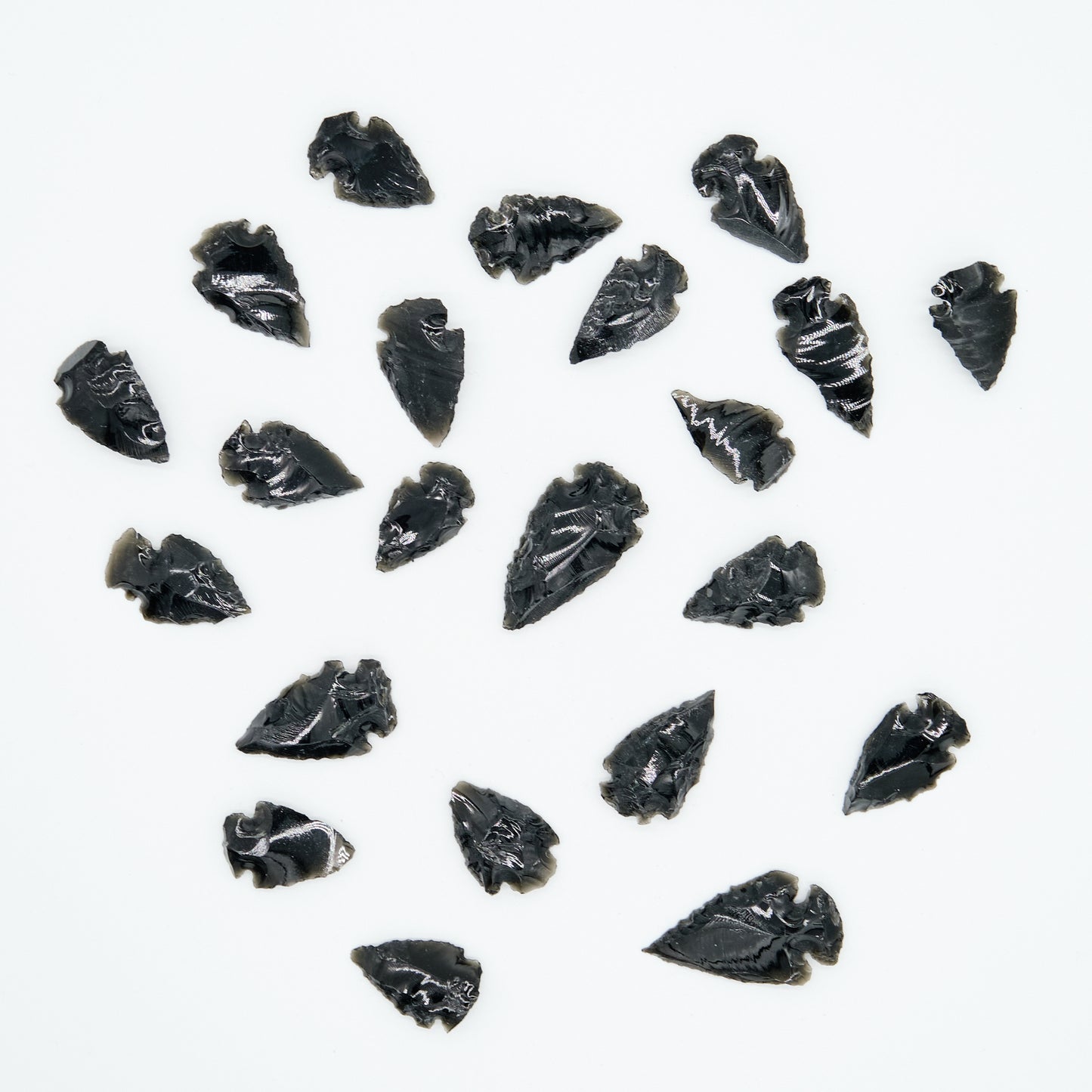 small black obsidian arrowhead carved rough crystal