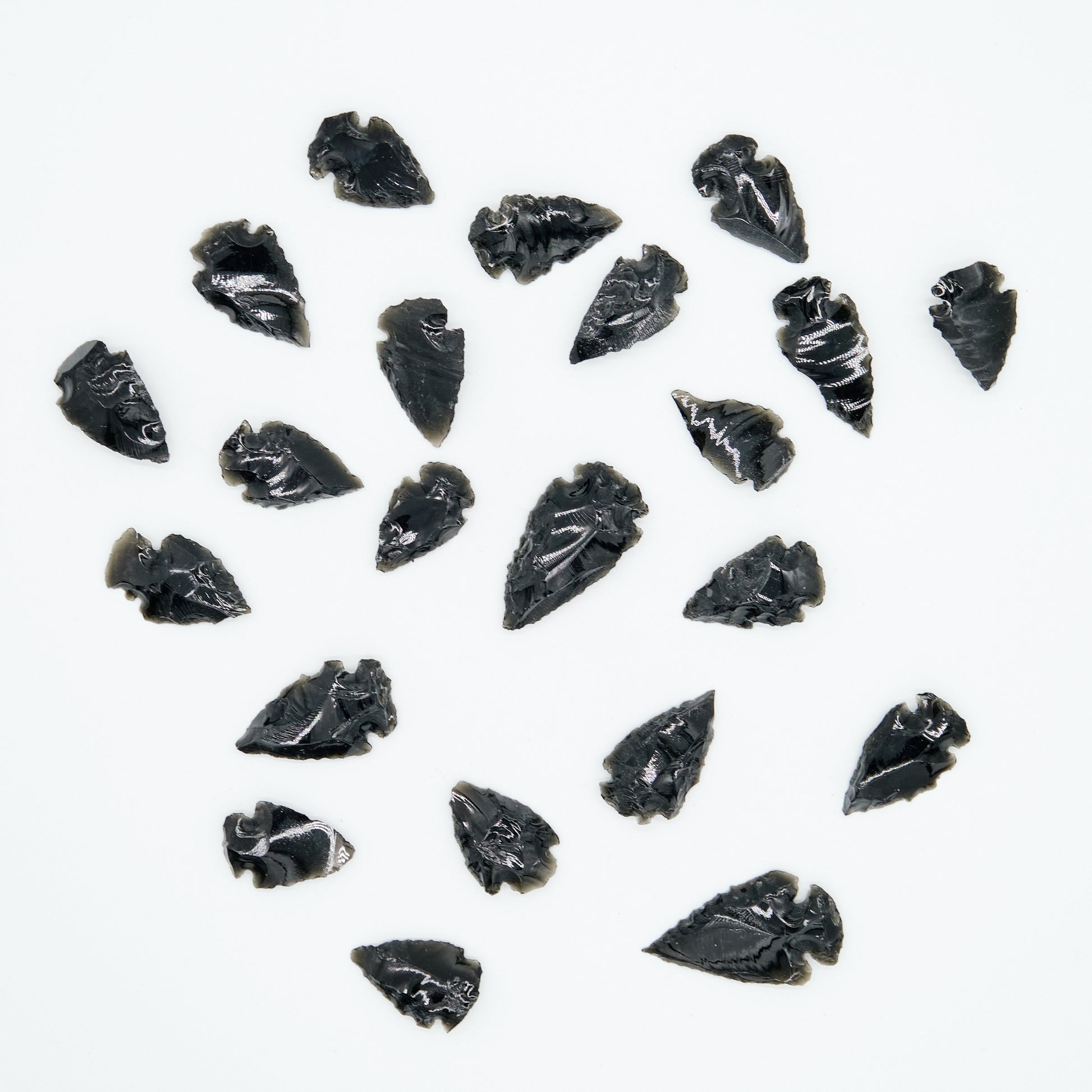 small black obsidian arrowhead carved rough crystal