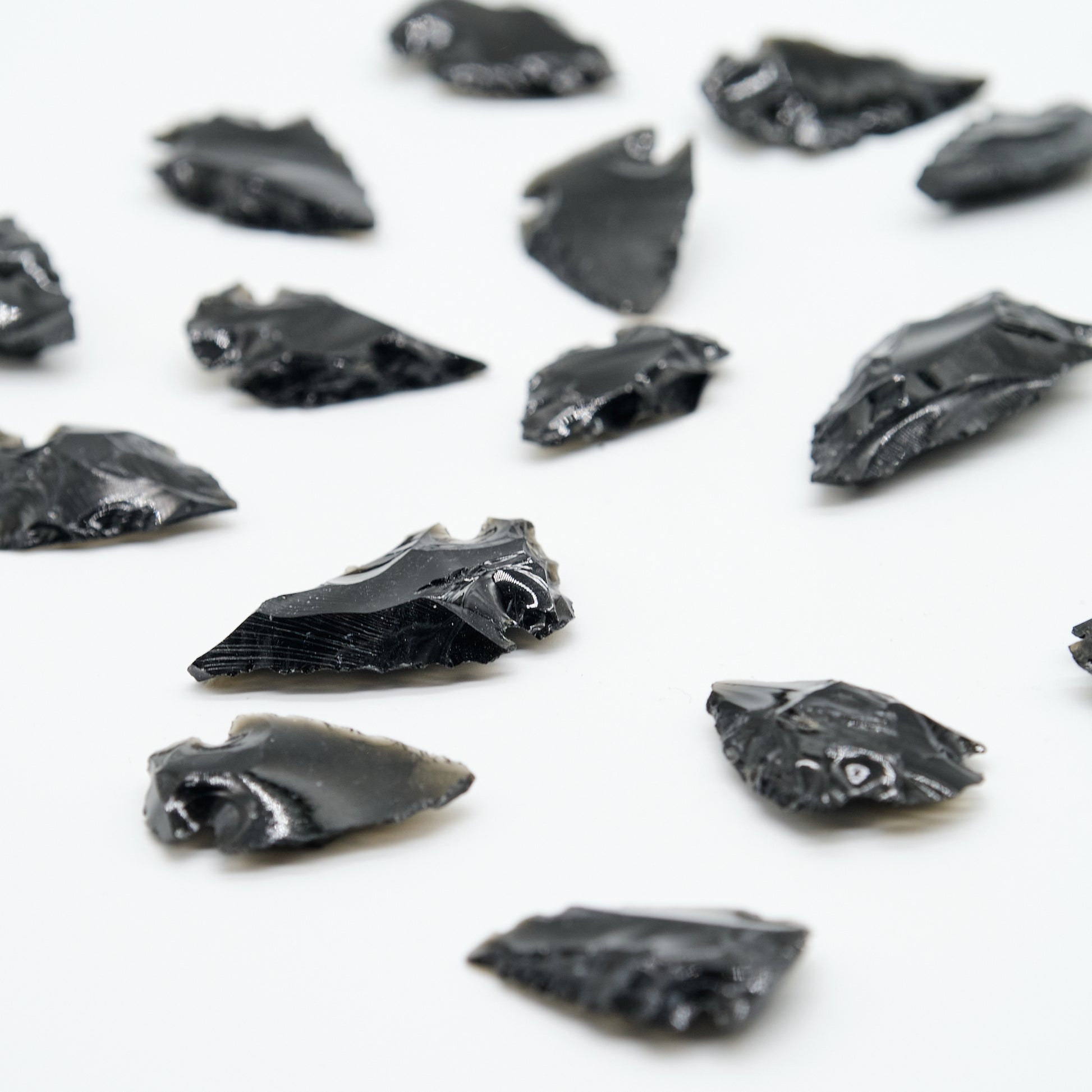 small black obsidian arrowhead carved rough crystal