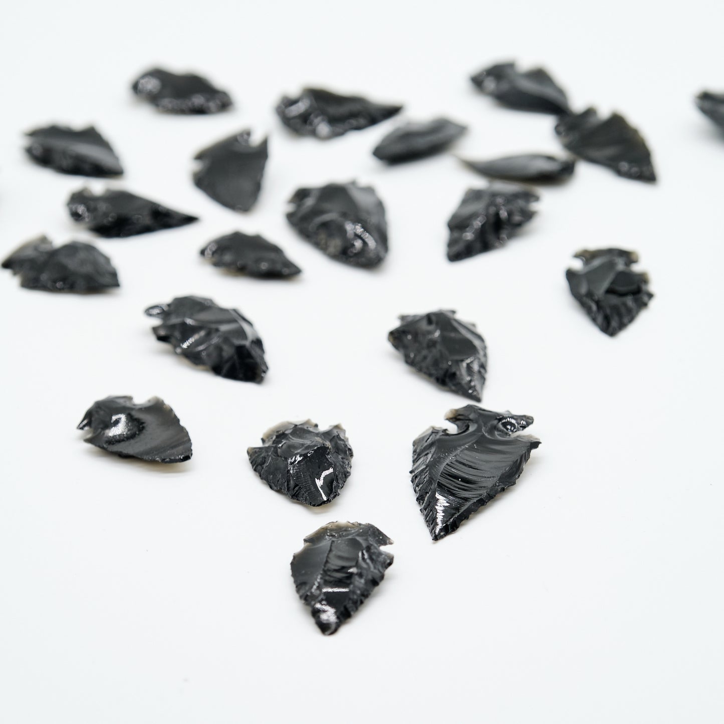 small black obsidian arrowhead carved rough crystal