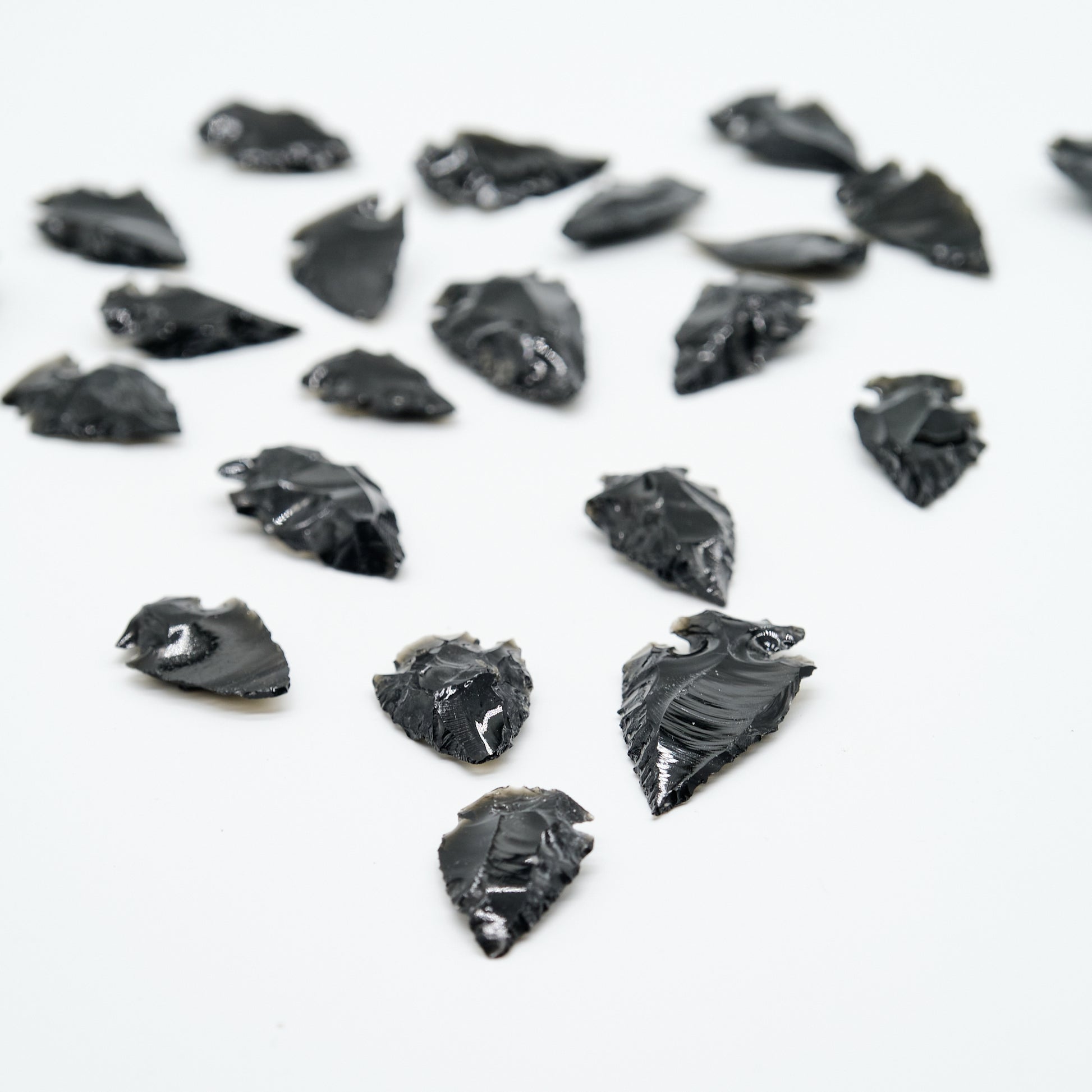 small black obsidian arrowhead carved rough crystal